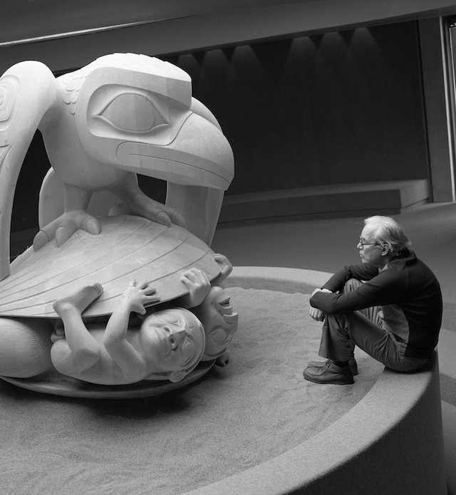 Bill Reid with his sculpture, Raven and the First Men, c.1980. Photo by Bill McLennan. Courtesy UBC Museum of Anthropology, Vancouver, Canada.