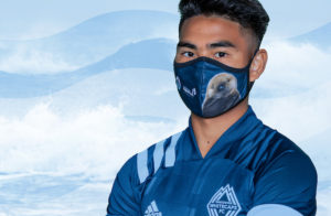Joey the Rescued Sea Otter Face Masks