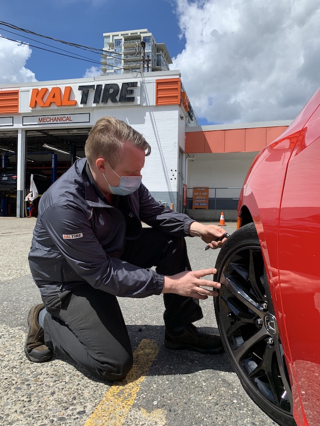 Barrie checking tire depth at Kal Tire in New West