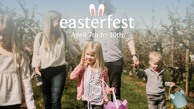 A family walks through the field at Taves Easterfest