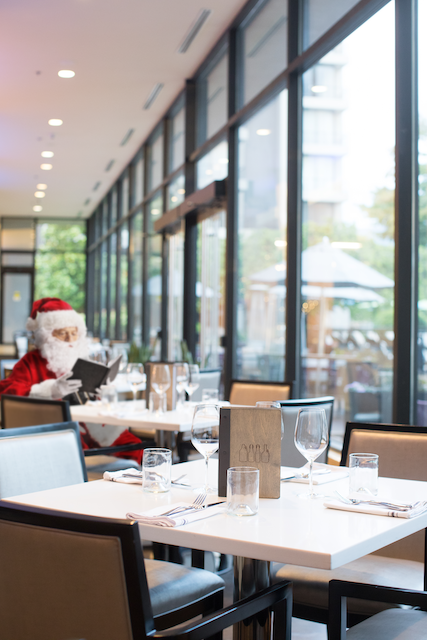 Santa having brunch in an empty restaurant