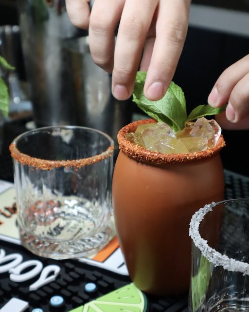 Cocktail being made by bartender at Barra Gitano