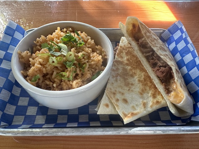 Quesadilla and a side of rice on tray at Gringo