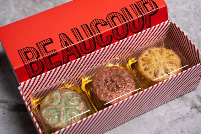 Three Mooncake Maisons in Beaucoup Bakery box, Mango Cheesecake, Ovaltine Sesame and Pistachio Yuzu