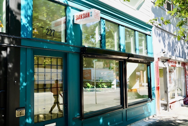 Bright blue exterior of the historic building for the new Saan Saan Cafe 