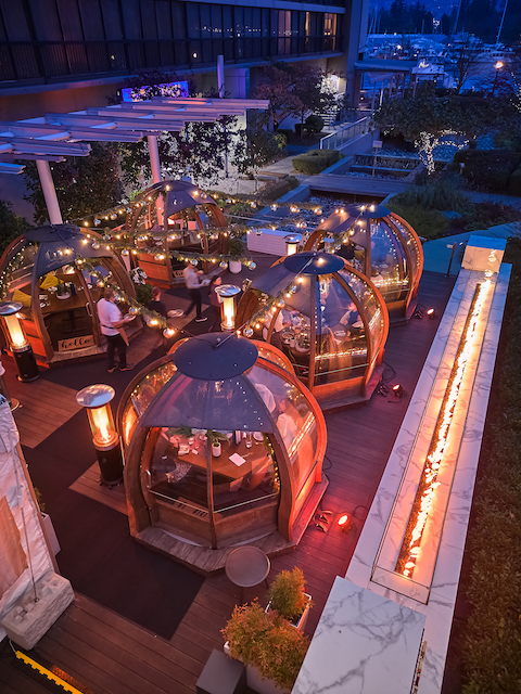 Outdoor dining winter domes with string lighting and fireplaces at H Tasting Lounge's patio