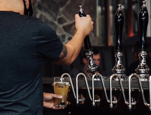 Smugglers Trail Langley Moments of Wild tap beer being poured by bartender