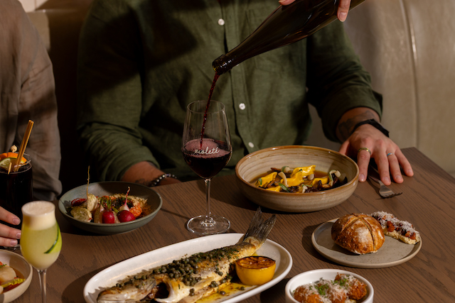 Violete Kitchen variety of dishes and red wine
